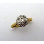 AN 18CT GOLD DIAMOND CLUSTER RING, with single cut diamond detail to the plain tapered band, stamped