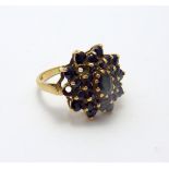 A 9CT GOLD SAPPHIRE CLUSTER RING, hallmarks for London 1978, ring size O
