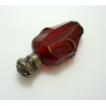 A RUBY SILVER TOPPED SCENT BOTTLE