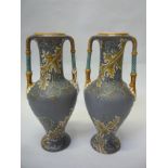 A PAIR OF METTLACH TWIN HANDLED VASES, No.2414, height 34cm (2)