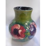 A MOORCROFT POTTERY VASE, decorated with Anenome against green ground, impressed and painted