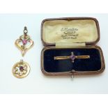 THREE ITEMS OF JEWELLERY, to include two open work pendants and a pearl and amethyst brooch