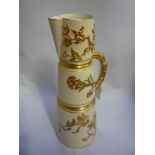 A ROYAL WORCESTER JUG, of tapering form with naturalistic gilt handle and coppered decoration,