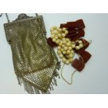THREE ITEMS, to include ivory and amber beads along with a mesh dress bag