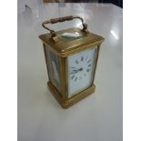 A BRASS CARRIAGE CLOCK, with key and winder