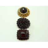 THREE GARNET BROOCHES