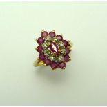A 9CT GOLD RUBY AND DIAMOND RING, with central marquise shape ruby within a surround of diamond
