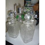 A GLASS CLARET JUG AND THREE CUT GLASS DECANTERS, (4)