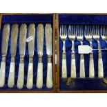 A CASED SET OF MOTHER OF PEARL SILVER COLOURED FISH KNIVES