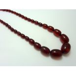 A RED AMBER BEAD NECKLACE