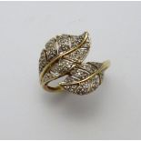 A 9CT GOLD DRESS RING, with overlapping leaf shapes with single cut diamond accents, ring size O 1/