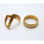 TWO RINGS, the first a band ring, the second a wishbone ring, both 9ct gold hallmarks, ring sizes
