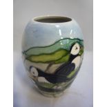 A BOXED MOORCROFT POTTERY VASE, decorated in the Puffin pattern, impressed marks and dated 97,
