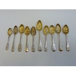TEN VARIOUS SILVER FRUIT SPOONS, George III to early Victorian, typical embossed gilt bowls and