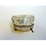 AN EDWARDIAN SILVER JEWEL CASKET, Birmingham 1919, of cushion shape with shell feet, engraved with