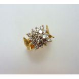 AN 18CT GOLD DIAMOND CLUSTER RING, the brilliant cut diamonds within a raised square shape to a