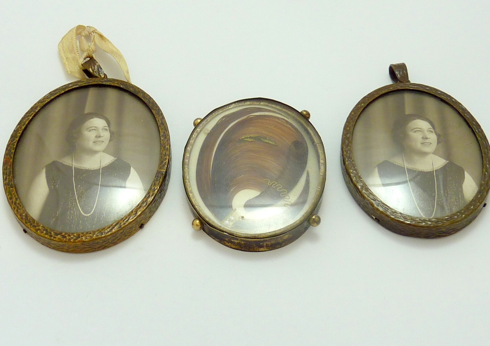 THREE MEMORIAL LOCKETS, the first two of picture portraits, the third with a locket and hair