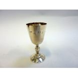 A SILVER PRESENTATION GOBLET, Birmingham 1972, the funnel bowl engraved with armorial crest and '