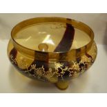 A SMOKEY GLASS BOWL, with enamelled prunes decoration beneath a gilt rim (s.d.)