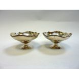 A PAIR OF SILVER TAZZAS, Birmingham 1937, Ogee shape with moulded serpentine rims, each 15.5cm