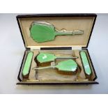 A CASED ENAMELLED SILVER DRESSING TABLE SET, Adie Brothers, Birmingham 1932, of Art Deco form with