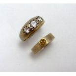 TWO RINGS, the first to include a gypsy ring together with a silver band ring, with gold plated