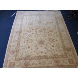 AN AFGHAN 100% WOOL PILE HAND KNOTTED OATMEAL GROUND CARPET, approximate size 305cm x 244cm, G.H.