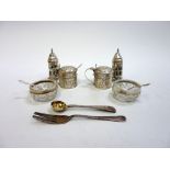 A GROUP OF EDWARDIAN SILVER CONDIMENTS, to include a pair of repousse mustard pots, a pair of