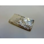 A LATE VICTORIAN SILVER CARD HOLDER, Birmingham 1901, embossed with neo-rococo leaf scrolls around a