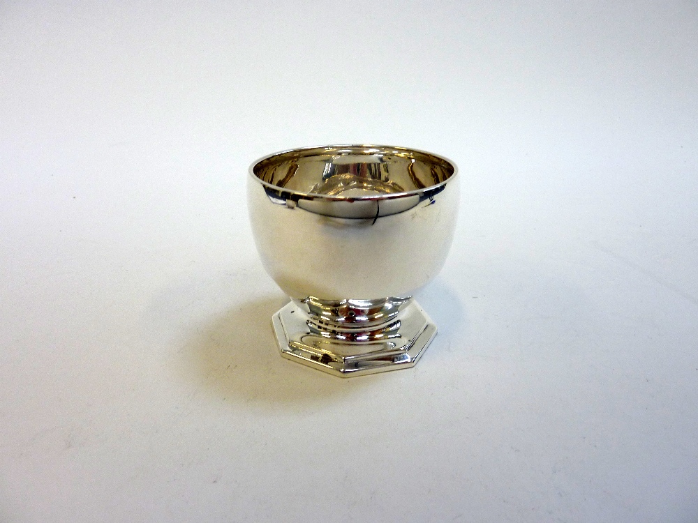 A SILVER CUP, Sheffield 1938, of Art Deco Ogee shape with octagonal foot, 6cm high, approximately