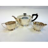 A SILVER ART DECO STYLE THREE PIECE TEASET, Sheffield 1970 and 1971, of facet shape with angular