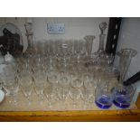 VARIOUS ETCHED GLASSES, two cut glass decanters, a pair of vases with plated bases etc