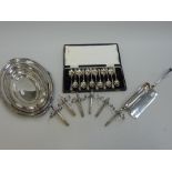 SIX SILVER PLATED ASPARAGUS NIPS, a plated crumb sweeper, a boxed set of plated spoons, a plated