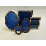 FOUR VARIOUS MODERN SILVER MOUNTED PHOTOGRAPH FRAMES, three oval and one rectangular, 12cm and