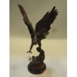A BRONZE FIGURE OF AN EAGLE, height 41.5cm