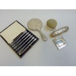 A GROUP OF SILVER WARES, to include a Victorian embossed dressing table brush, a cased set of