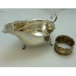 A SILVER SAUCE BOAT, and napkin ring (2)