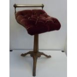 A VICTORIAN CAST IRON AND VELVET REVOLVING STOOL, the scroll profile seat with buttoned claret