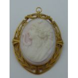 AN ANTIQUE CAMEO PENDANT BROOCH, the pink conch cameo depicting Roman Goddess Diana the Huntress