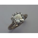 A DIAMOND RING, the brilliant cut diamond to the plain tapered shank, estimated weight spreads at