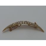 A VICTORIAN OLD-CUT DIAMOND CRESCENT BROOCH, the graduated old-cut diamonds within the half crescent