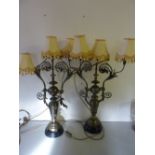 A PAIR OF VICTORIAN BRASS THREE BRANCH TABLE LAMPS, of vase form surmounted by ball and knop stems
