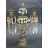 A PARCEL GILT BRONZE AND GLASS LUSTRE CANDELABRA, in the Empire style with triple gryphon stem