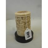 A SMALL CANTON CARVED IVORY TUSK VASE, decorated in relief with figures amid dense foliage and