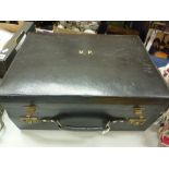 AN INTER-WAR PERIOD FITTED LEATHER VANITY CASE, c,1935, the black stitched leather with brass/gilt