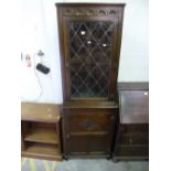 AN OAK GLAZED CORNER CUPBOARD, (key)