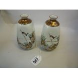 A PAIR OF JAPANESE KUTANI VASES, of cuboid tapering form with everted rims, finely painted with