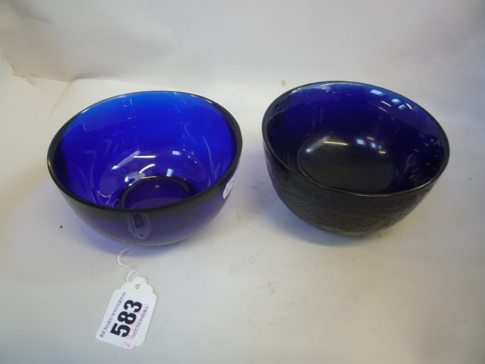TWO CHINESE BLUE GLASS BOWLS, in the 18th Century manner but probably Republic, plain rounded form