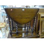 AN OAK BARLEY TWIST DROP LEAF TABLE