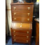 AN EDWARDIAN WALNUT CHEST ON BUREAU, 76cm wide, 47cm deep, 158cm high (situated in furniture room)